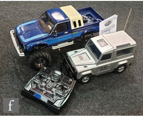 A Tamiya 1:10 scale radio control Toyota 4x4 Pick-up Truck 58519 Bruiser, built with instructions, together with a David Hals