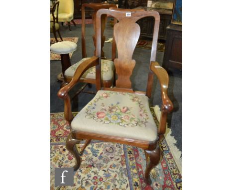 A set of eight 1920s Queen Anne style walnut dining chairs, each with a vase-shaped splat above a slip in tapestry seat on ca