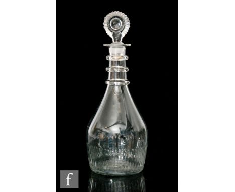 An Irish Cork Waterloo Glass Co. decanter, circa 1800, of mallet form with three applied rings to neck and basal column mould