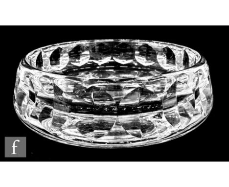 An Orrefors clear crystal bowl, the thick walls cut with a repeat mitre cut circle design, engraved signature, diameter 23cm.