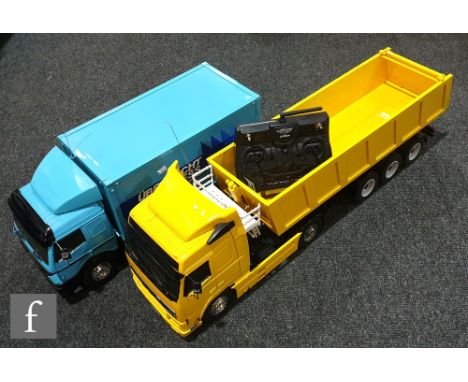 Two 1:14 scale radio control models, the first composed of a Tamiya 56312 Volvo FH12 Globetrotter 420 tractor unit in yellow 