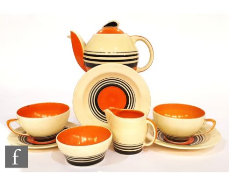 A 1930s Susie Cooper Art Deco tea for two comprising a Kestrel teapot, two teacups, two saucers, milk jug, sugar bowl and a s