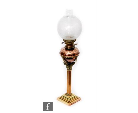 A Victorian copper and brass oil lamp with acid etched shade on floral reservoir on Corinthian column and stepped base, heigh