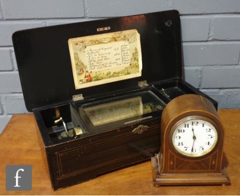 A musical box playing eight airs, serial number 22096, 15.5cm cylinder in inlaid rosewood case, the cover decorated with a pa