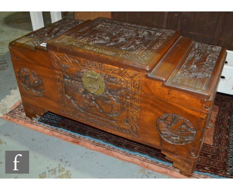 A small carved camphorwood coffer decorated with Chinese characters, on bracket feet, height 41cm x depth 36cm x width 77cm, 