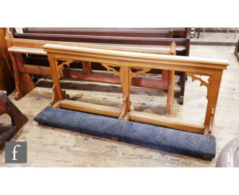A 20th Century light oak Gothic revival alter rail with kneel cushioned rest, height 78cm x depth 53cm x length 130cm, also a