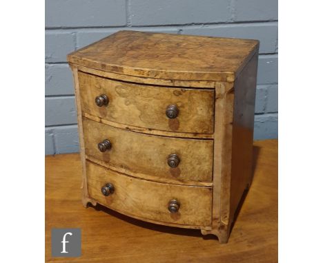 A small Victorian figured walnut three drawer bow front apprentice chest, turned wood handles on bracket feet, width 28cm. 