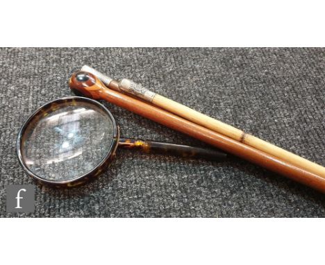 Two military batons, an inlaid wooden baton and a simulated tortoiseshell magnifying glass. (4) 