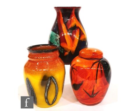 A Poole Pottery ginger jar in the Himalayan Poppy pattern, height 17.5cm, together with two other Poole vases, a Delphis vase