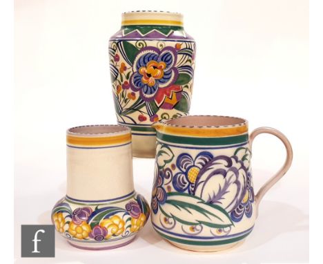 Three pieces of 1930s to 1940s Poole Pottery comprising a V pattern vase, height 23cm, a ZY pattern vase, height 16cm and a V