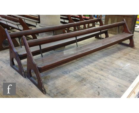 A long pine pew with iron bar support and prayer or hymn book shelf, shaped open ends, height 88cm x depth 66cm x length 333c