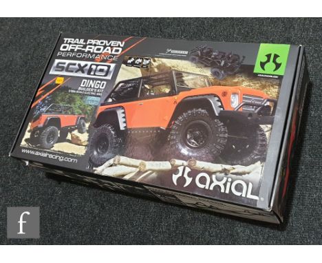 An Axial 1:10 scale AX90021 SCX10 electric four wheel drive truck model kit with Dingo body, boxed. 