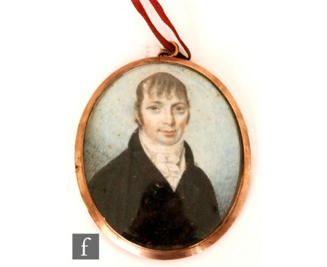 ENGLISH SCHOOL (EARLY 19TH CENTURY) - Portrait of a young man wearing a black coat and stock, watercolour miniature on ivory,