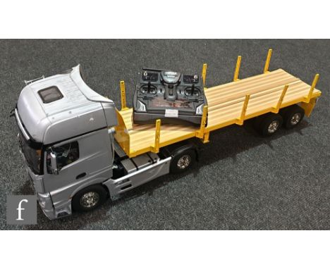 A Tamiya 1:14 scale remote control model composed of a 56335 Mercedes-Benz Actros 1851 Gigaspace tractor unit and a 56306 Fla