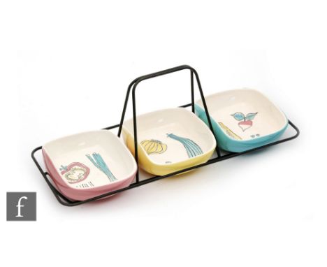 A Midwinter Stylecraft Salad Ware nut dish designed by Terence Conran, the three rounded rectangular bowls within a black met