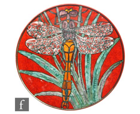 A large later 20th Century Poole Pottery Studio plaque decorated by Tony Morris with a dragonfly over foliage and a deep red 