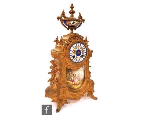 A late 19th to early 20th Century French gilt metal 8-day mantle clock, of architectural form, the Sevres style porcelain dia