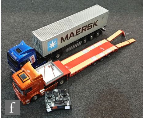 Two 1:14 scale remote control models, the first composed of Tamiya 56323 Scania R620 6x4 Highline tractor unit with a Carson 