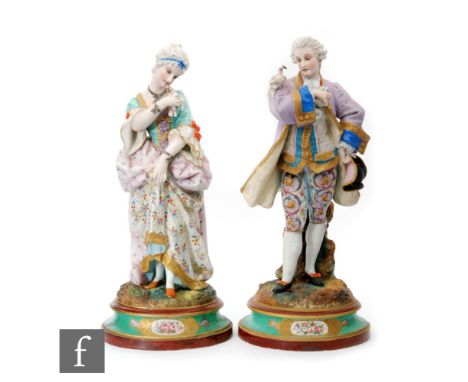 A pair of 19th Century French tinted bisque figures depicting a lady and gentleman in period dress each with a dove, both pic