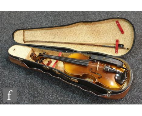 A 20th Century Czech violin bears label Antonius Stradivarius Cremonensis, length 36cm and bow cased and brown outer zip case