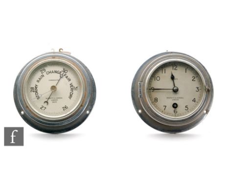An eight day chromed cased bulk head clock and matching barometer by Negretti &amp; Zambra No 12633. 