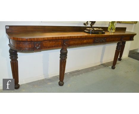 Amended description - A 19th Century mahogany serving table or buffet of shallow form with shelf back over a carved panelled 