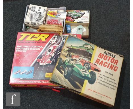 An Airfix Motor Racing slot car set, appears complete, with two 1:32 scale cars, a Ferrari and a Cooper, together with a sele