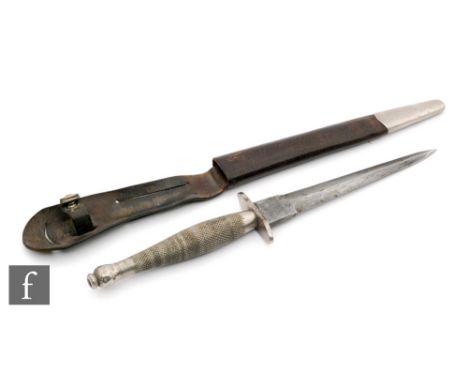 A World War Two Fairbarn Sykes first pattern F-S Fighting Knife, with nickel plated knurled grip and an S-shaped crossguard, 