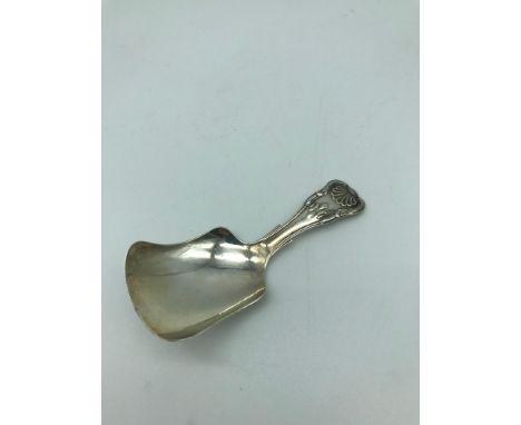 A Silver Birmingham Georgian caddy spoon. Makers Unite &amp; Hilliard, dated 1833. 