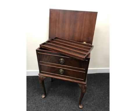 A One drawer sewing table with lift up lid and lift out shelf storage.