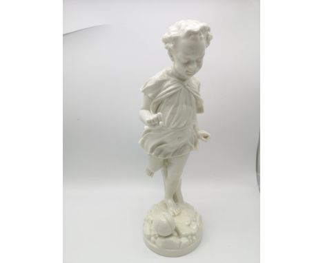 A Royal Worcester Parian Figurine, depicting a boy playing with a ball (30cm in height) 