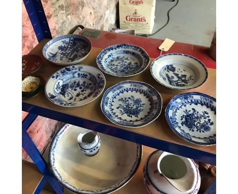 A shelf of oriental blue &amp; white plates 