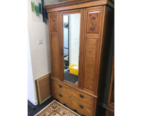 A Victorian light oak mirror front wardrobe with 2 under drawers. Measures 190x120x51cm 