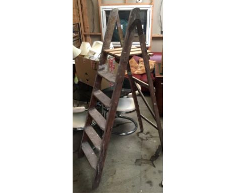 A set of redwood step ladders.