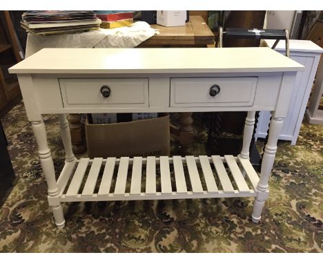 A painted table with two drawers above a slatted shelf. 720 mm H x 930 mm W x 300 mm D.