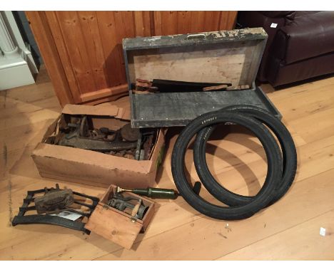 A saw box and saws, various tools including grease gun and vices.
