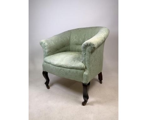 A Victorian button backed tub chair with ceramic castors. W:73cm x D:55cm x H:75cm