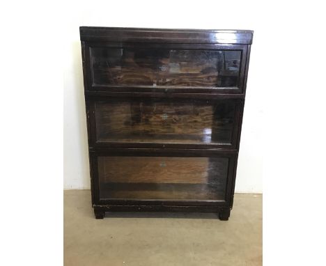 A Globe Wernicke Ltd oak three section bookcase. Each section with the Globe Wernicke stamp. W:85cm x D:29cm x H:111cm