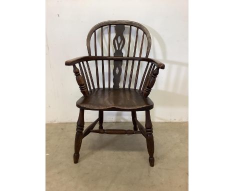 A Windsor smokers bow stick back arm chair with elm seat. 