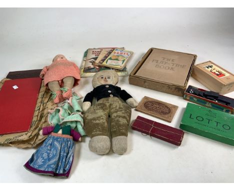 A collection of vintage games to include a Staunton chess set and three dolls. 