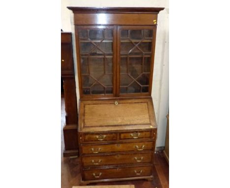 George III oak bureau bookcase on bracket feet. Condition report: see terms and conditions