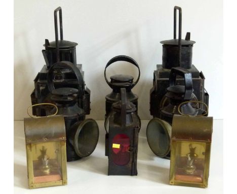 Two BR black oil lamps showing white; 6968 red/white cab oil lamp; LMS hand lamp; LT hand lamp; BR (M) hand lamp and two othe