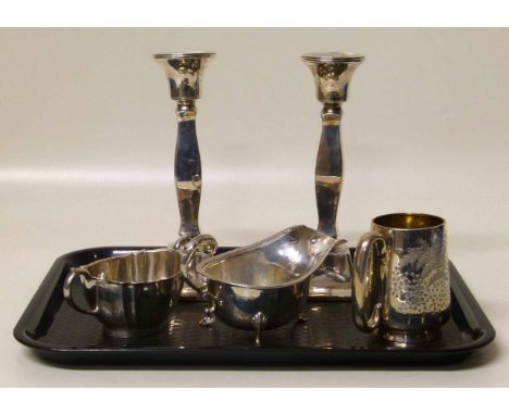 Two silver candlesticks, sauceboat, mug and sucrier Condition report: see terms and conditions