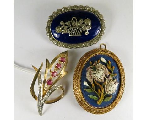 &nbsp;
A 19th century yellow metal micro mosaic brooch, a peridot ruby and diamond brooch and a silver paste brooch