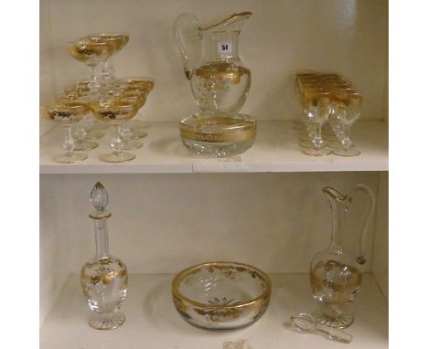 A late 19th/early 20th century St Louis, French gilded suite of table glass comprising, water jug, claret, decanter, bowl, Ch