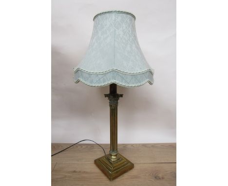A 19th Century brass corinthian column lamp with shade, 73cm tall