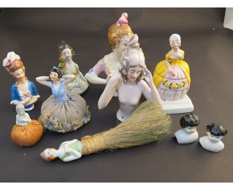 A collection of 39 ceramic pin cushion doll busts of varying styles and age
