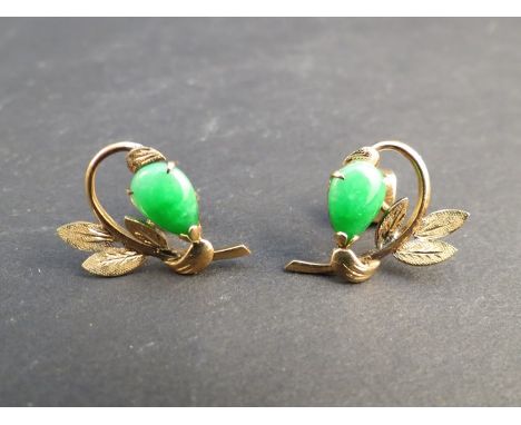 A pair of unmarked leaf and fruit form earrings set with jade