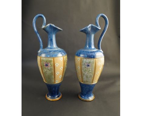 A pair of Royal Doulton ewer form vases, light blue bodies with gilt and floral panel bands, 30cm tall
