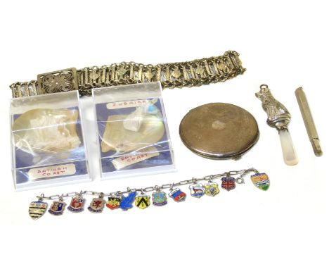 A selection of silver and white metal items, to include a silver and mother of pearl rattle hallmarked for Chester, 1961, a s